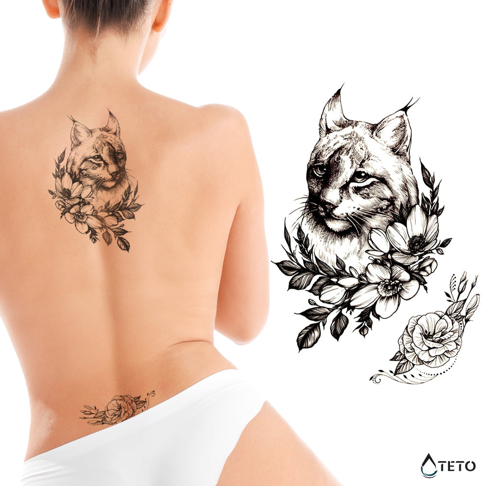 Luchs mit einer Blume